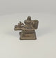 360-degree rotating view of a 19th century Indian brass Shiva Lingam and Nandi miniature devotional shrine, showing the stepped pedestal, recumbent Nandi bull, cylindrical fitting, and aged dark patina.