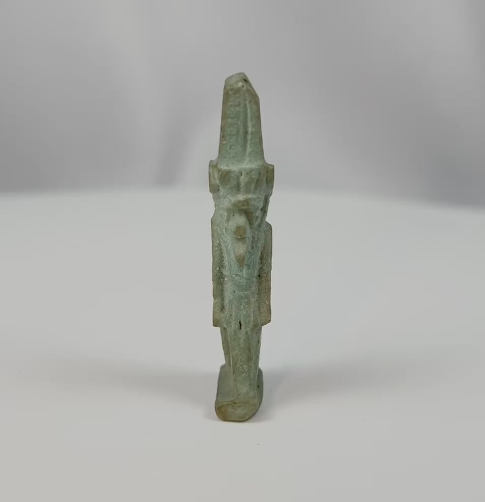 360-degree view of an ancient Egyptian pale green faience amulet depicting the god Nefertem with lotus crown from the Late Period to Ptolemaic era.