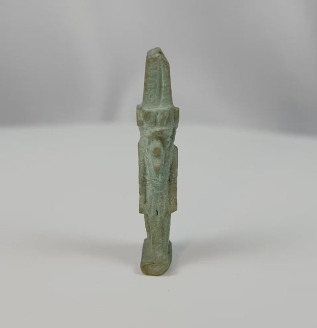 360-degree view of an ancient Egyptian pale green faience amulet depicting the god Nefertem with lotus crown from the Late Period to Ptolemaic era.