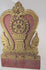 Thai Buddhist shrine panel carved from teakwood, gilded over red lacquer, featuring central dharmachakra and twin naga serpents, late 19th century, Rattanakosin/Lanna tradition, 24.5 x 15 inches