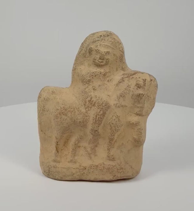 Rotating 360-degree view of an ancient Egyptian terracotta horse and rider figurine from the Roman Period, circa 1st–3rd century CE, featuring sculpted details, a weathered surface, and earthy tones.