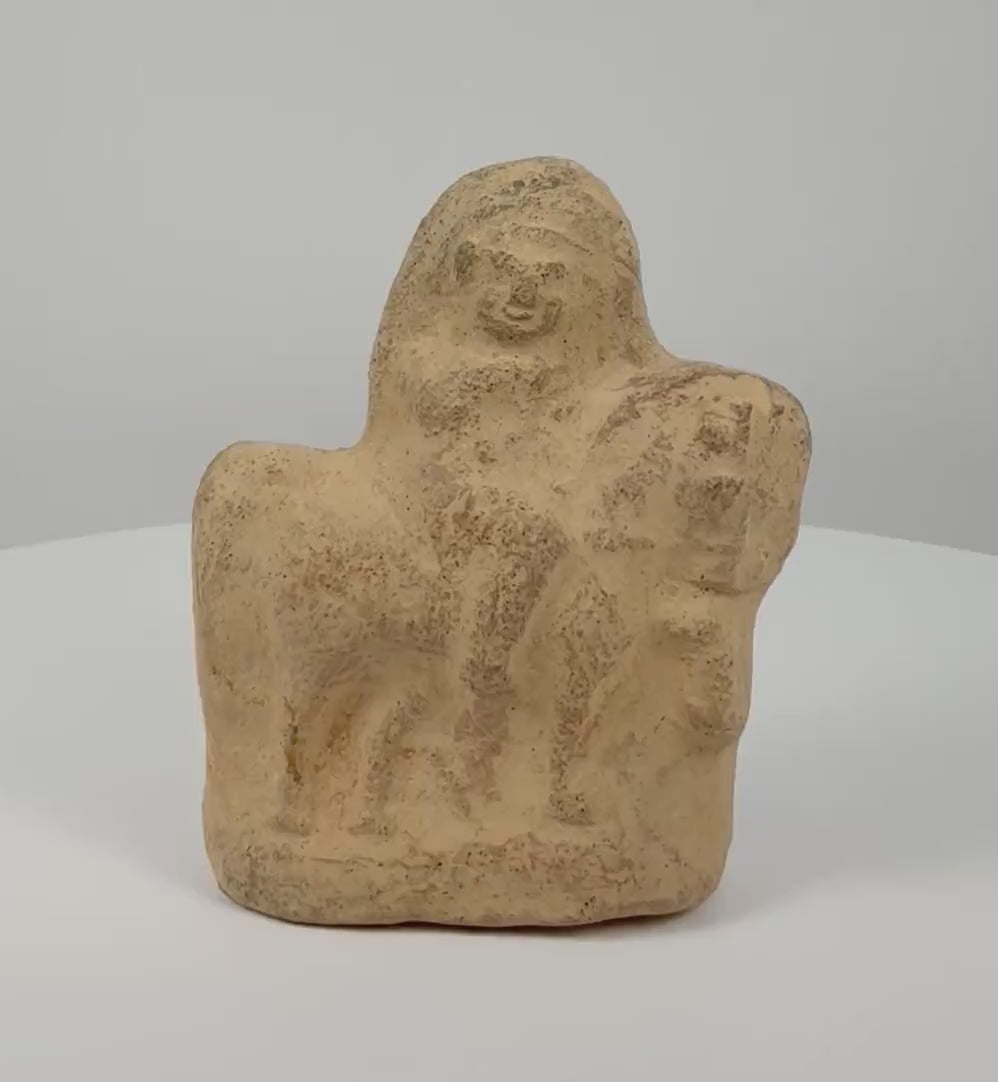 Rotating 360-degree view of an ancient Egyptian terracotta horse and rider figurine from the Roman Period, circa 1st–3rd century CE, featuring sculpted details, a weathered surface, and earthy tones.
