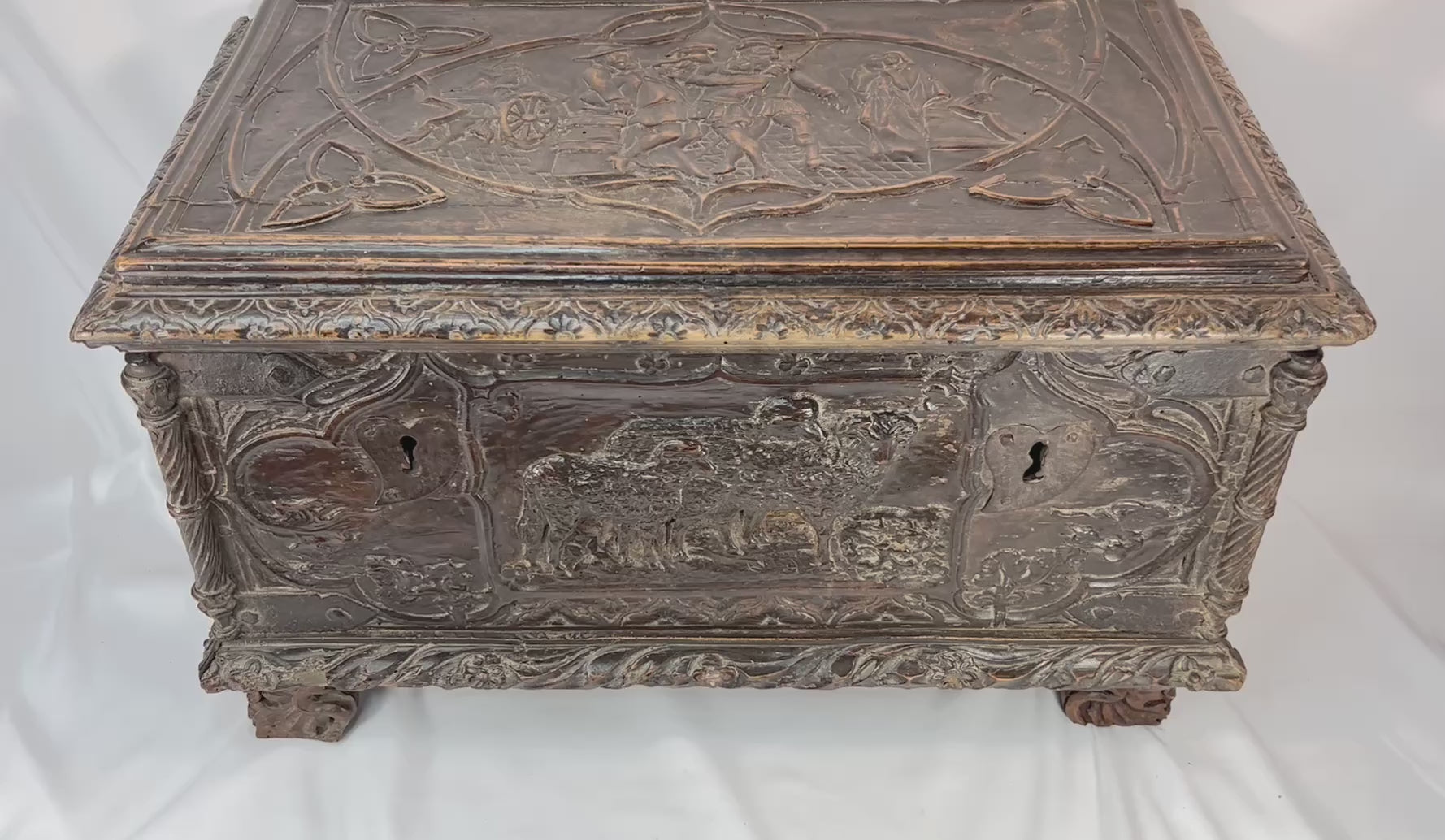 360-degree view of a Renaissance Italian cassone showcasing hand-carved figural panels, foliate motifs, scroll feet, and original patina, circa 1550–1650
