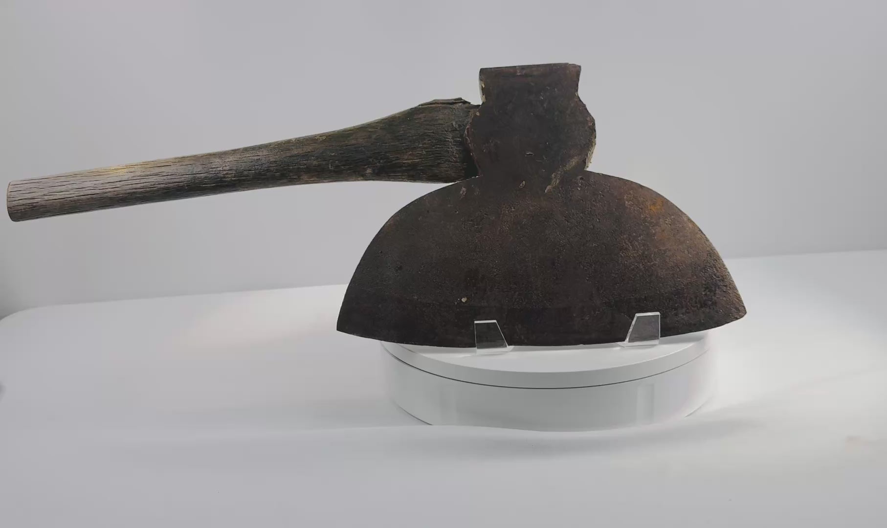 Rotating 360-degree video of a 19th-century M.H. Jones & Co. American broadhead axe, showing the forged steel blade, flat poll, original wooden handle, aged patina, and maker’s markings.
