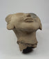 360-degree rotation of ancient terracotta head showing facial features and sculpted hair details.