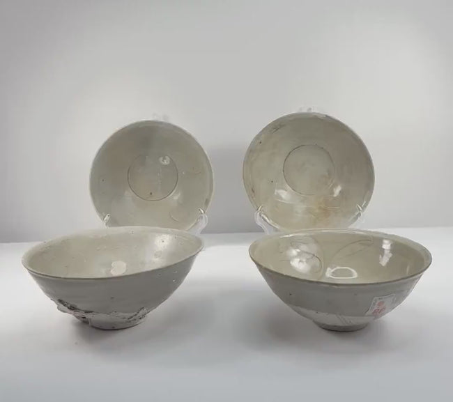Video showcasing four Song dynasty celadon bowls from Fujian, China, circa the 12th century, highlighting their pale green glaze, incised floral decoration, and rounded forms.