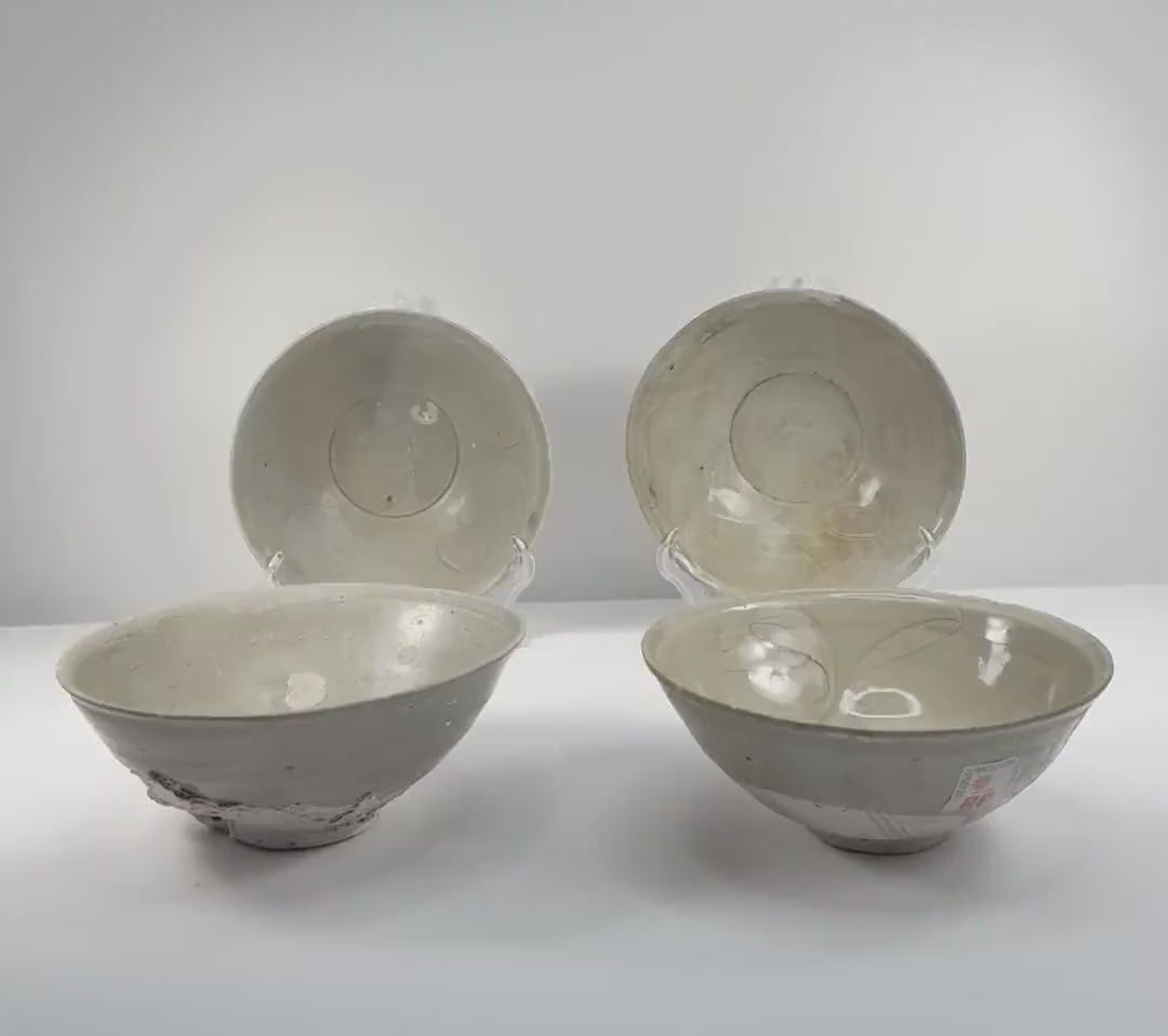 Video showcasing four Song dynasty celadon bowls from Fujian, China, circa the 12th century, highlighting their pale green glaze, incised floral decoration, and rounded forms.