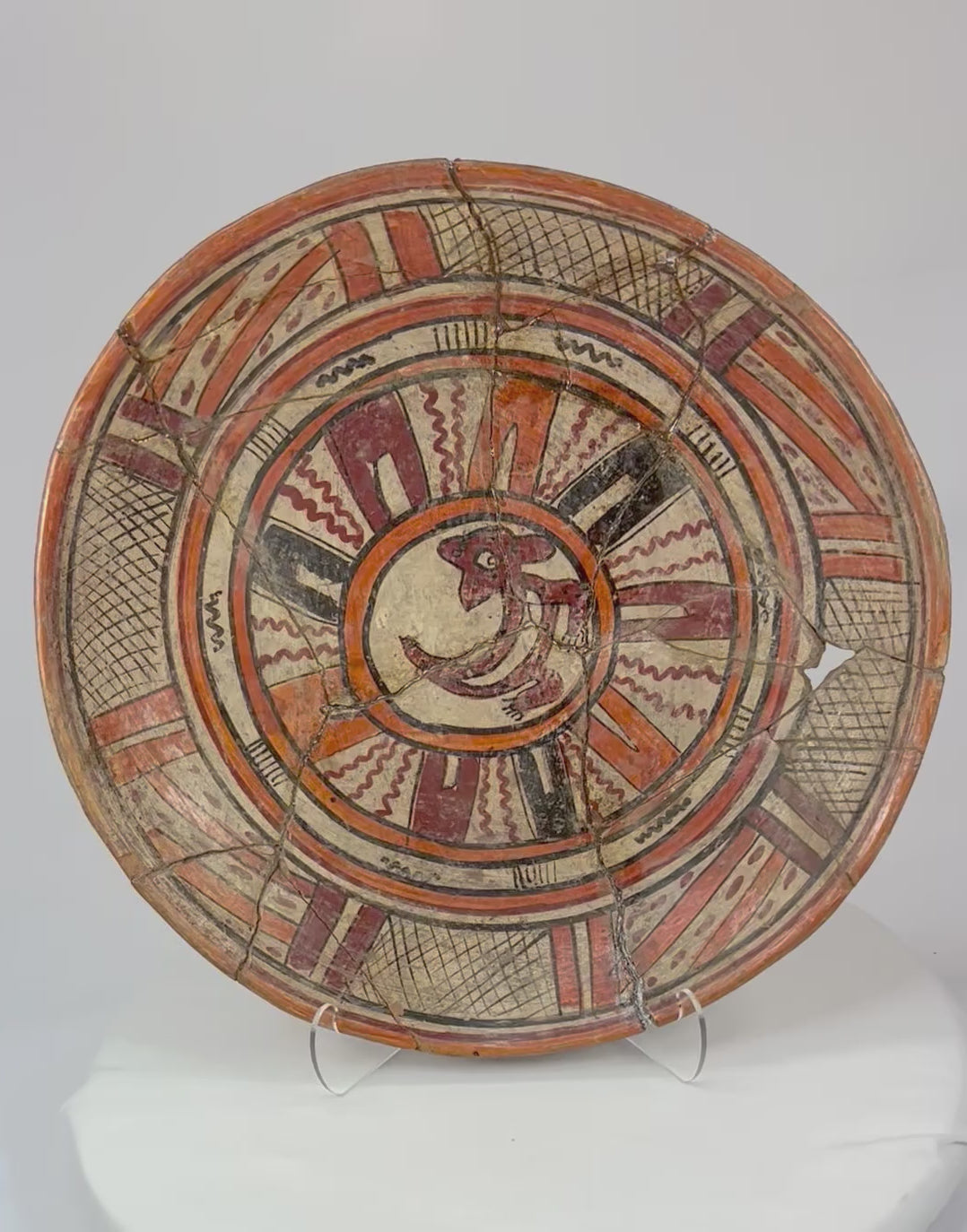 360-degree rotation of Mesoamerican polychrome ritual plate revealing detailed painted motifs and restored joins.