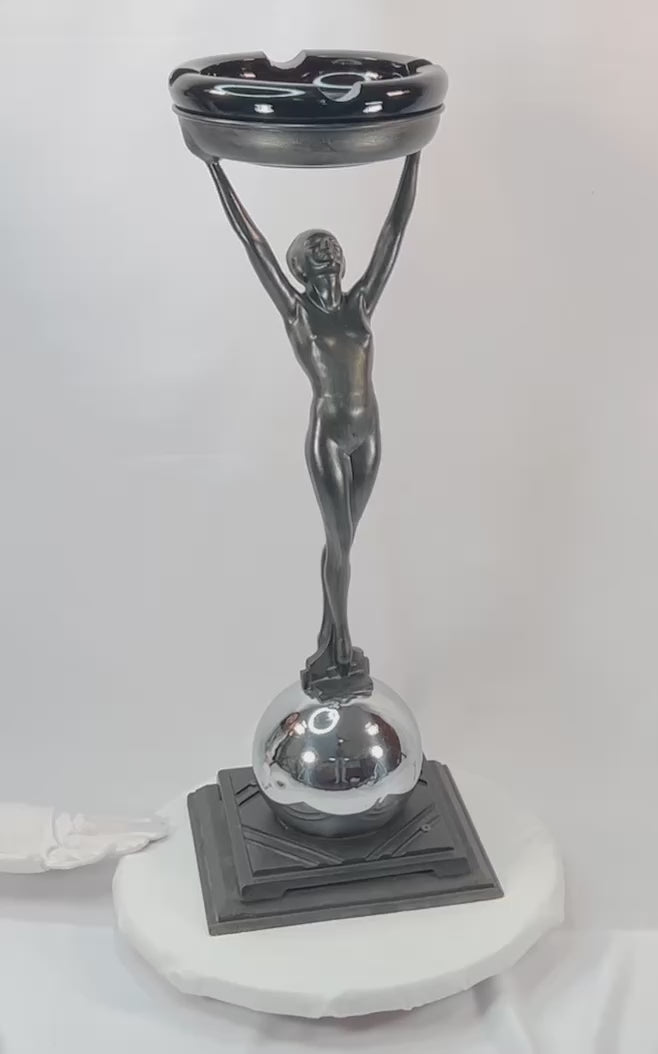 Rare Art Deco smoking stand, circa 1925–1935, attributed to Frankart Inc. New York. Features nude female figure with raised arms supporting circular tray, original patinated finish, and stepped Deco base. Iconic Jazz Age decorative design.