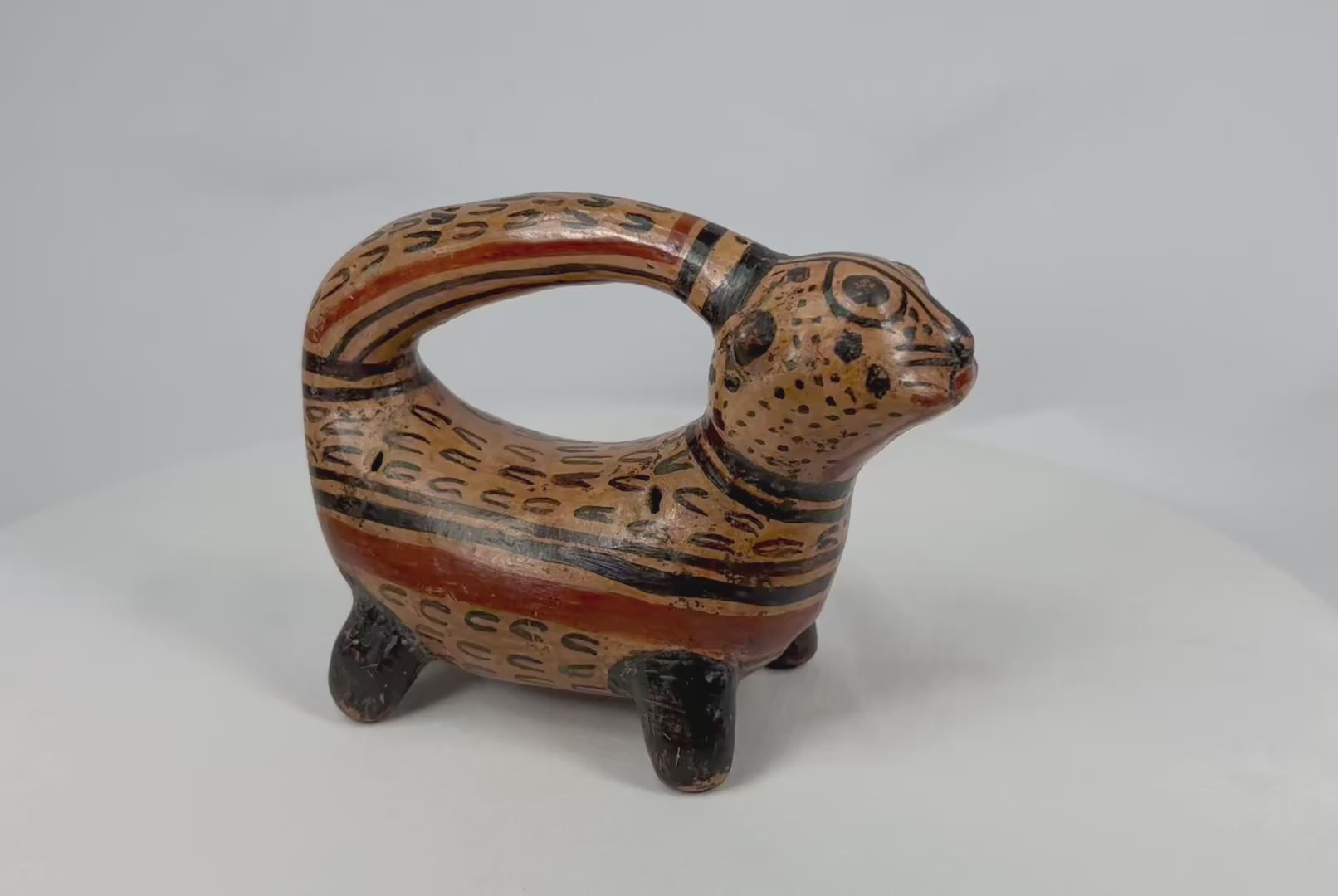 Rotating view of Pre-Columbian jaguar-form rattle vessel with painted red and black slip, Nicoya culture, 800–1200 ADv
