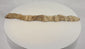 Video showing an ancient Egyptian mummified juvenile crocodile with original aged linen wrappings, preserved votive form, detailed surface views, and X-ray imagery confirming the crocodilian skeleton within.