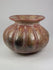 360-degree rotating view of a Pre-Columbian Moche-style globular ceramic vessel with red and beige painted surface patterns on a white background