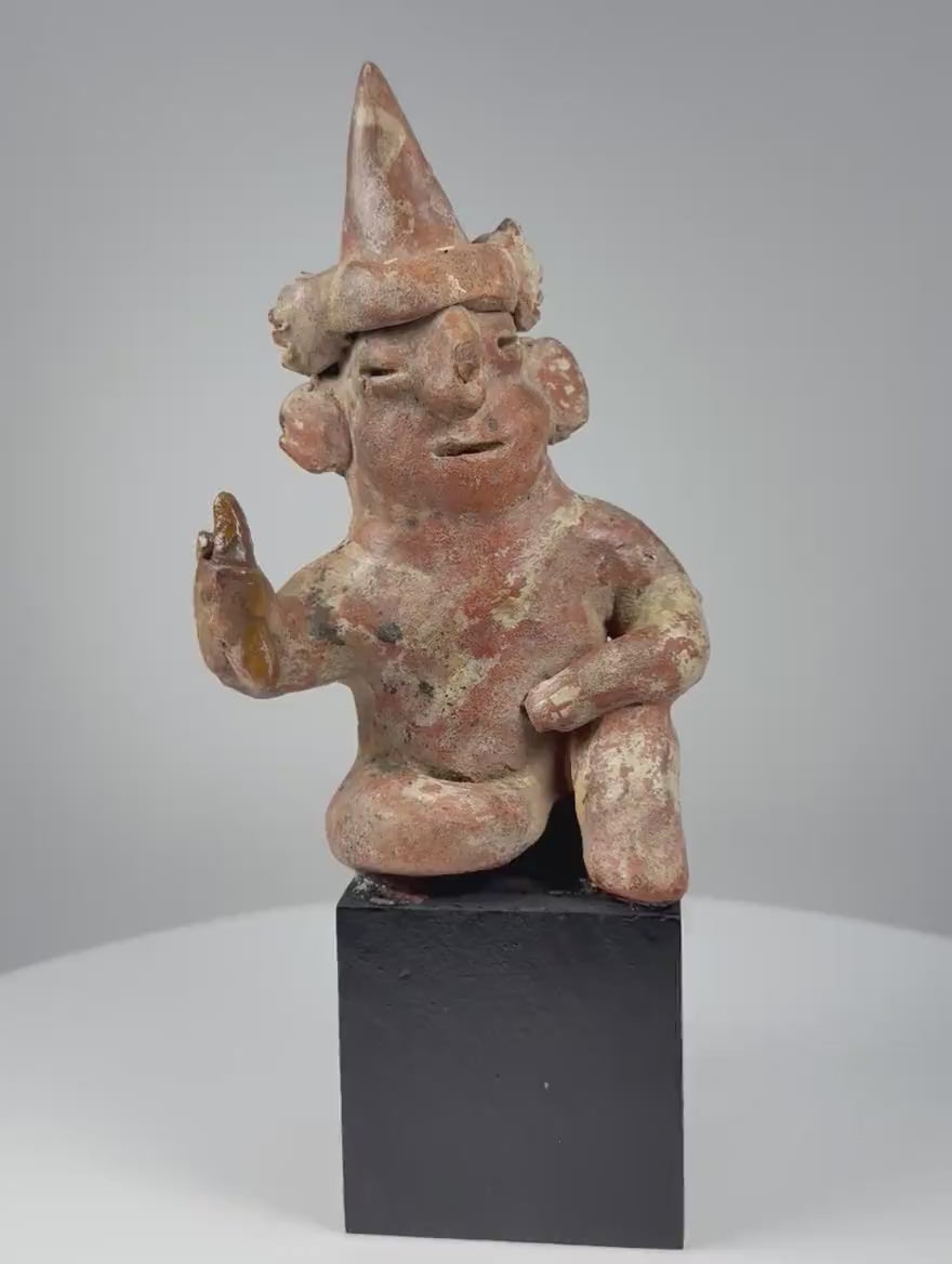 Nayarit seated terracotta figure with tall cone headdress from West Mexico, circa 100 BCE–300 CE, shown in rotating 360-degree video.