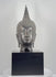 360-degree rotating view of a large 18-inch Thai bronze Buddha head attributed to the 19th-century Rattanakosin period, featuring Sukhothai-style spiral hair curls, a tall flame-shaped ushnisha, downcast eyes, elongated earlobes, a serene expression, dark metallic patina, and visible age-related wear and damage at the lower neck.
