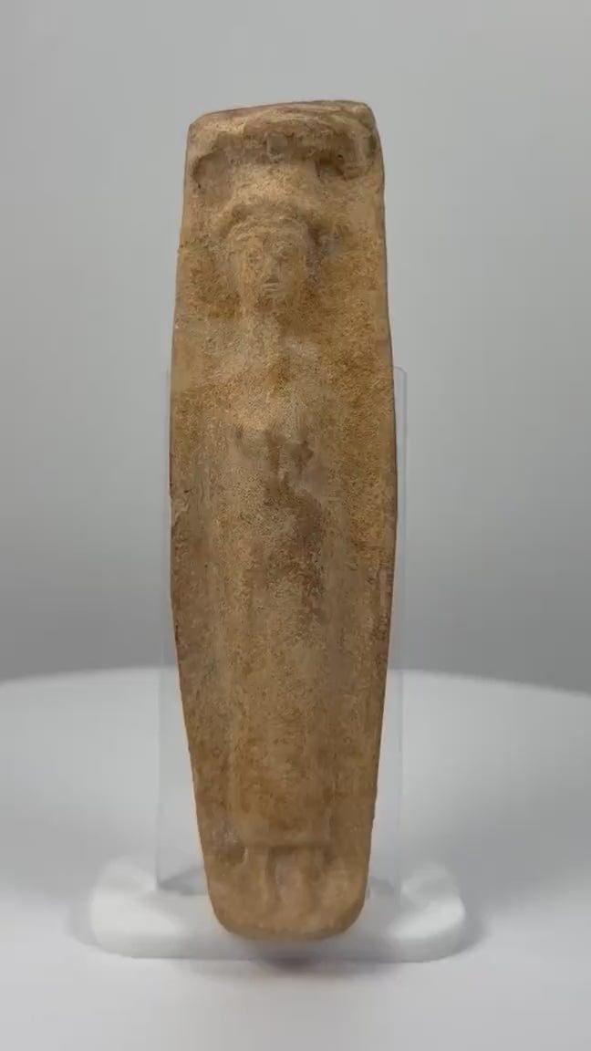 Ancient Roman terracotta fertility votive figure dating to the 1st–3rd century CE, featuring a stylized enshrouded human form, faint facial details, coarse hand-molded clay, natural earthen patina, mineral deposits, and age-related surface wear.