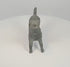 360-degree rotating view of a possibly ancient Roman bronze barking dog figurine, featuring an open mouth, raised head, decorative collar, extended legs, and distinctive curled tail. The sculpture displays dark green patination, surface wear, and a visible opening in the rear flank.