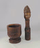 360° view of an 18th–19th century hand-carved wooden mortar and pestle with decorative face motif, showing full patina, carving details, and antique craftsmanship.