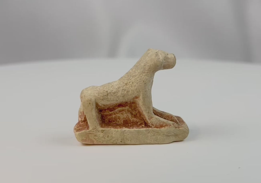 360-degree view of an ancient Egyptian carved limestone lioness figure from the Late Period showing the reclining posture and natural archaeological patina.