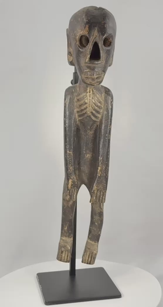 Video showing Rapa Nui-inspired moai kavakava wooden figure from multiple angles and close-up details