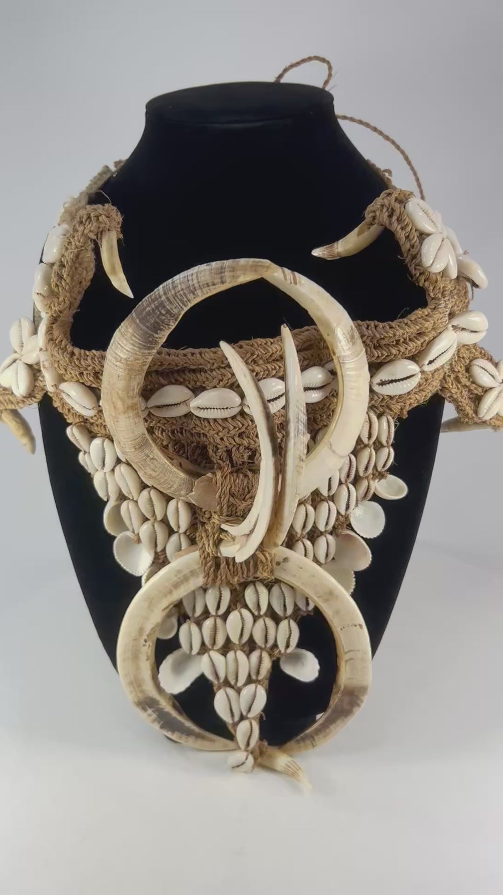 Rotating video of early 20th-century ceremonial regalia made of cowrie shells and boar tusks