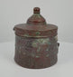 360-degree rotating video of an antique Islamic Khorasan bronze inkwell dating to the 10th–12th century CE, featuring intricate engraved floral and geometric motifs, traditional Islamic metalwork, and a rich natural bronze patina. A historical writing instrument from the Islamic Golden Age, showcasing its decorative craftsmanship and age-related surface details from multiple angles.