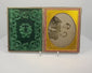 Video showcasing a mid-19th-century cased ambrotype of a woman and child with gilt-brass mat, green velvet lining, handwritten family label, and embossed case