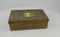 Antique gold portrait box with engraved detailing shown on a white studio background.
