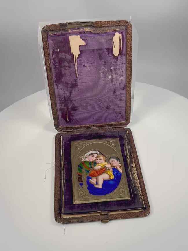 Rotating view of antique enamel Madonna and Child devotional miniature with leather case and velvet interior