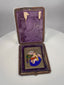 Rotating view of antique enamel Madonna and Child devotional miniature with leather case and velvet interior