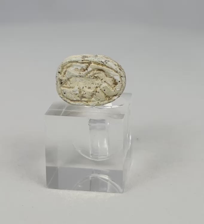 Rotating video of an authentic Ancient Egyptian New Kingdom carved steatite scarab amulet.