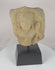 Video showing a 12th-century Khmer stone fragment depicting Padmapani Avalokitesvara from Cambodia, with serene facial features, refined Angkor-period carving, weathered stone surfaces, and preserved sculptural details associated with Buddhist devotional art.