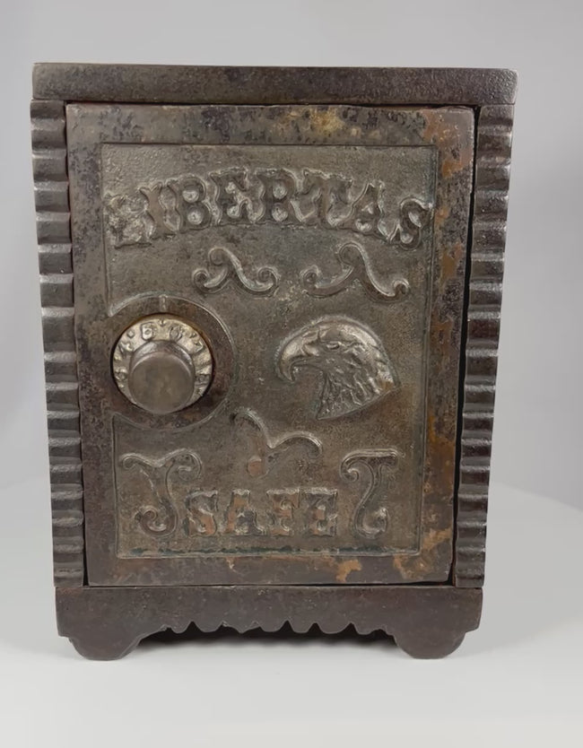 Antique Libertas Safe cast iron still bank rotating view showing front panel, door function, and detailed design