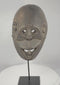 Rotating video of a West Timor ritual mask from Fatuleu Village, circa 1930, displaying traditional Atoni carving traditions, large pierced eyes, an open mouth with protruding tongue, and an aged hardwood surface.