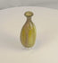 360-degree view of an ancient Roman free-blown olive green glass flask, circa 1st–3rd Century AD, showcasing its vertically fluted body, flared rim, archaeological weathering, mineral deposits, and authentic Roman glassmaking craftsmanship.