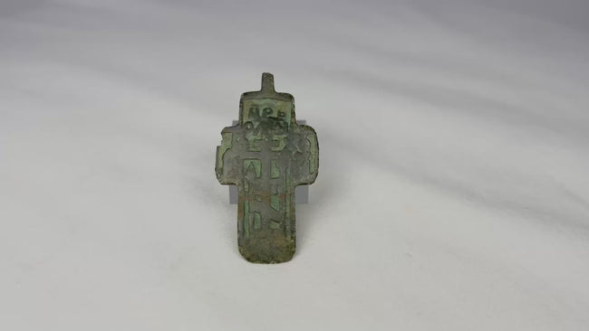360-degree rotating view of a late 18th–early 19th century Russian Old Believer copper devotional cross showing green champlevé enamel details, Cyrillic inscription panels, and aged patina.