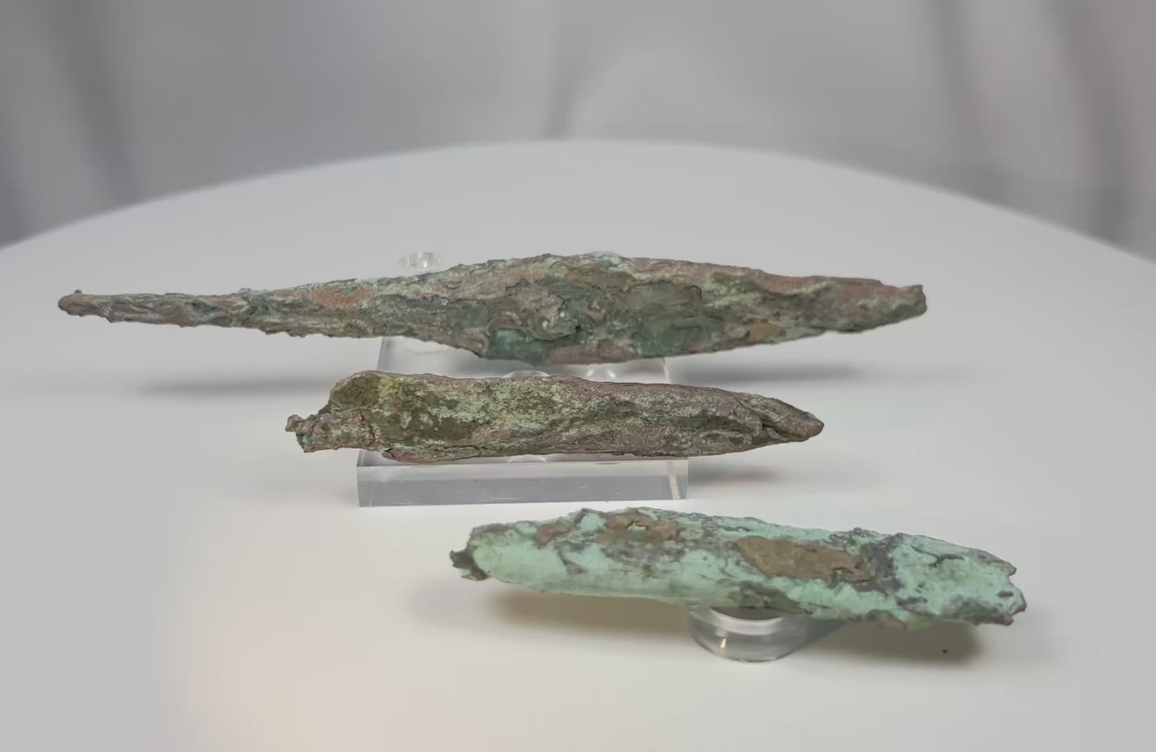360-degree view of prehistoric Old Copper Culture native copper projectile points from Wisconsin showing natural patina and hammered copper surfaces.