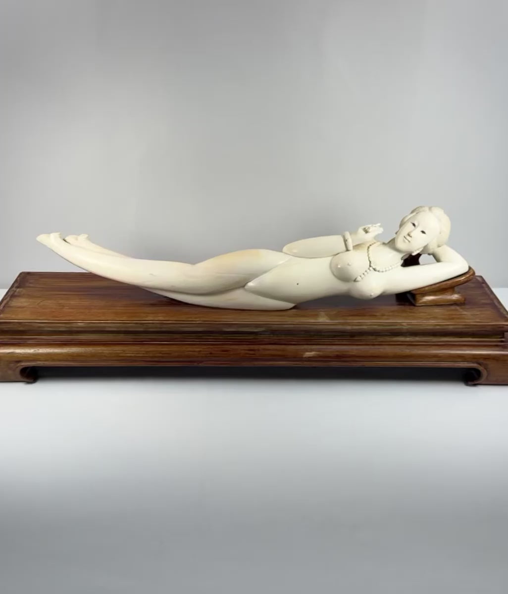 Video showing multiple views and carved details of a monumental mid-20th-century Chinese doctor’s lady-inspired reclining female figure with a custom hardwood pedestal