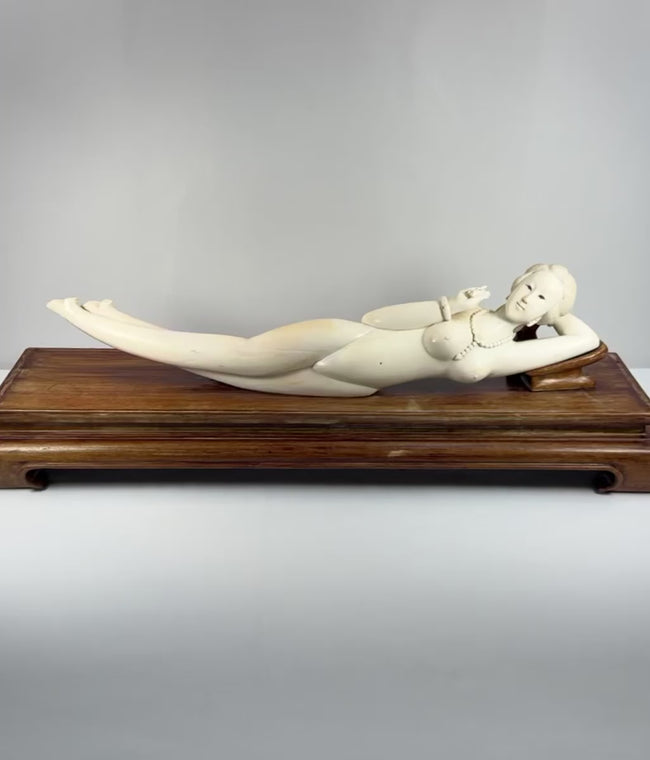 Video showing multiple views and carved details of a monumental mid-20th-century Chinese doctor’s lady-inspired reclining female figure with a custom hardwood pedestal