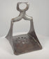 Rotating 360-degree video of a 17th-century Ottoman forged steel stirrup, showing its triangular frame, pierced floral footplate, broad saddle loop, silver damascening traces, and aged patina.
