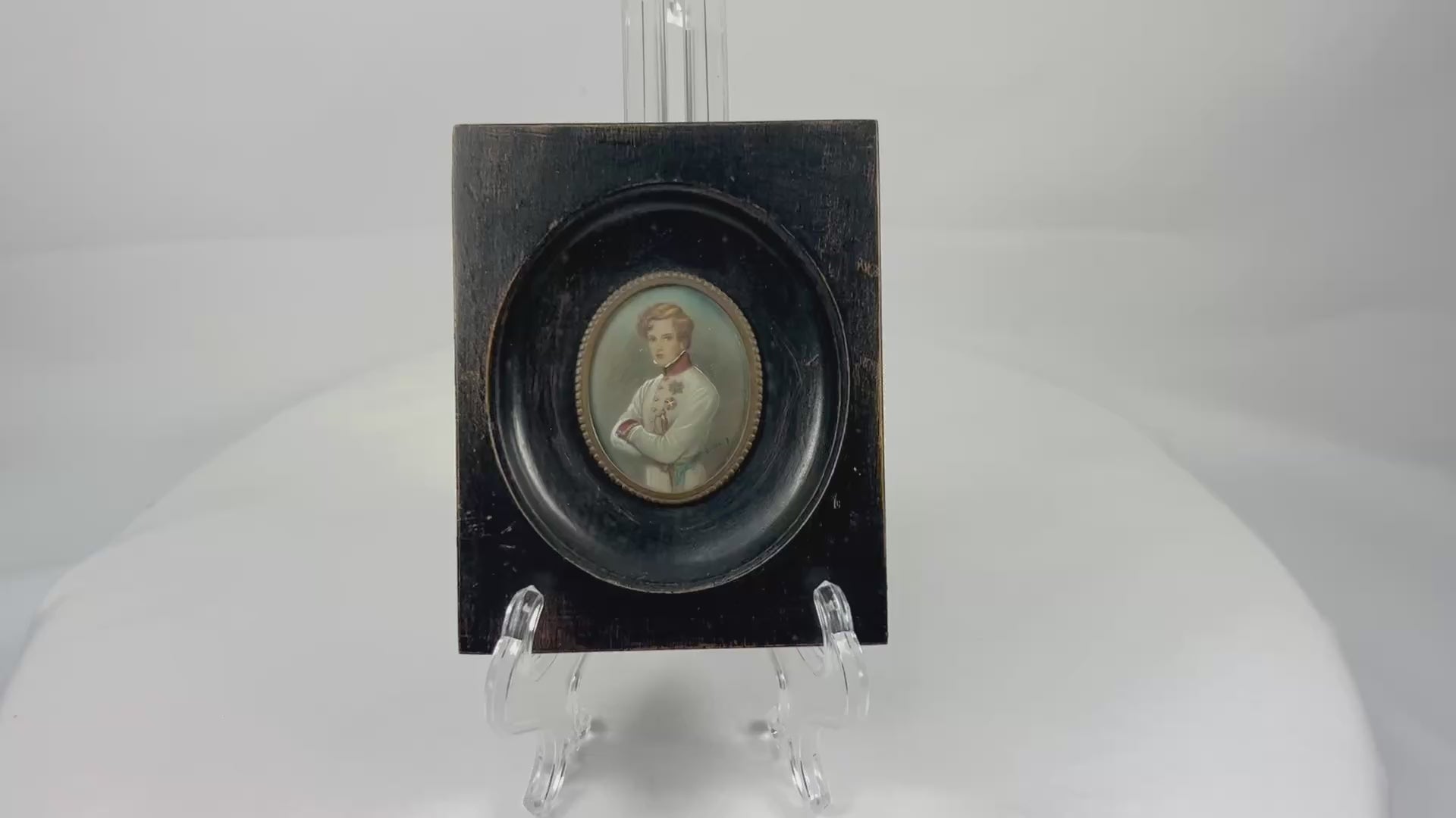 Finely painted mid–late 19th-century miniature portrait of Napoleon II, Duke of Reichstadt, in Austrian white dress uniform with red collar and blue sash, gouache on wafer under glass, set in original ebonized wood frame with brass bezel, Central Europe, circa 1860–1885.