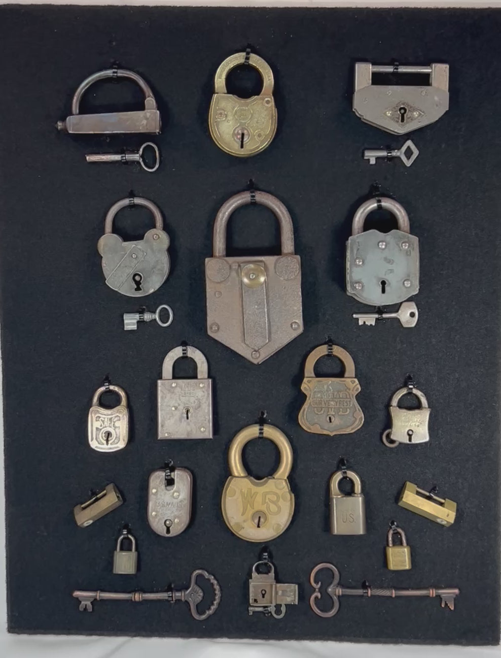 Framed collection of antique locks and keys rotating view showing variety of padlocks and skeleton keys