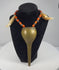 Video showing an antique Konyak Naga warrior necklace with brass pendant, glass trade beads and paired animal teeth