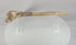 Video showing a 19th-century New Guinea ritual dagger carved from human bone, with painted geometric decoration, preserved feather embellishments, a tapered blade form, and natural age-related patina.