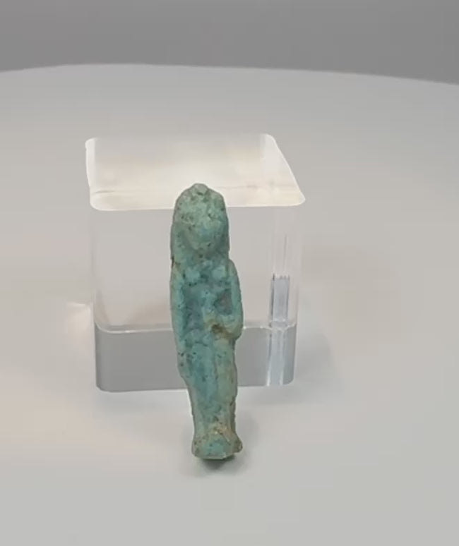 Video showing multiple views, feline features and turquoise-blue glaze details of an ancient Egyptian Sekhmet or Bastet faience amulet