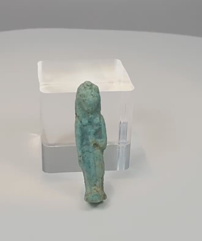 Video showing multiple views, feline features and turquoise-blue glaze details of an ancient Egyptian Sekhmet or Bastet faience amulet