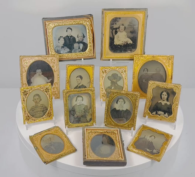 Video showcasing a collection of 13 mid-19th-century Victorian cased portrait photographs, likely ambrotypes and tintypes, with gilt-brass mats and period cases