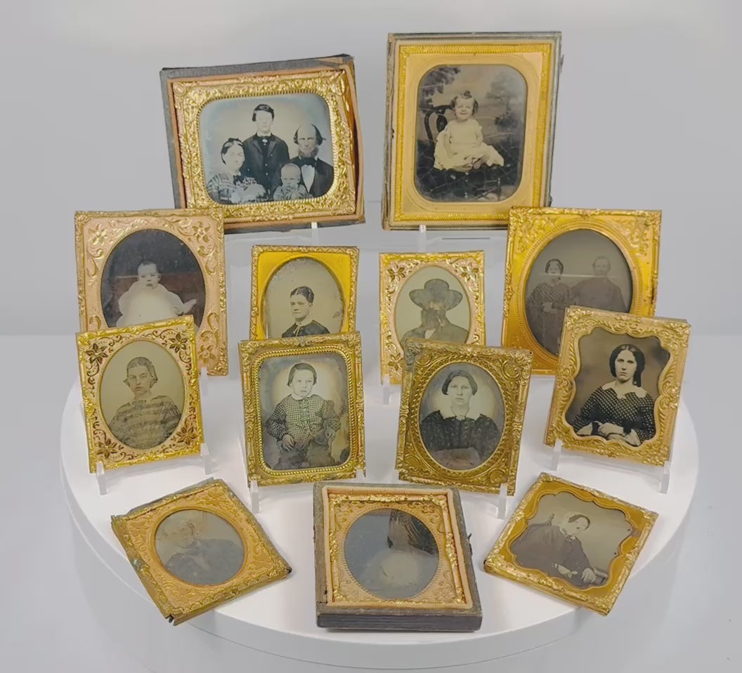 Video showcasing a collection of 13 mid-19th-century Victorian cased portrait photographs, likely ambrotypes and tintypes, with gilt-brass mats and period cases