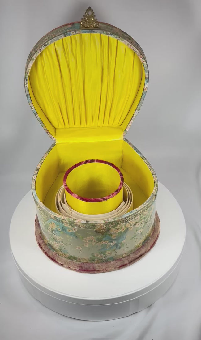 360° rotating view of an Edwardian collar box with embossed decoration, silk-lined interior, and detachable linen collars