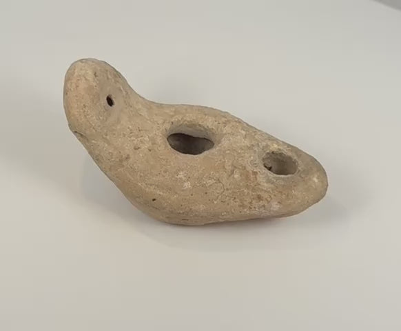 360-degree rotating video of an ancient Eastern Mediterranean terracotta oil lamp with filling and wick apertures