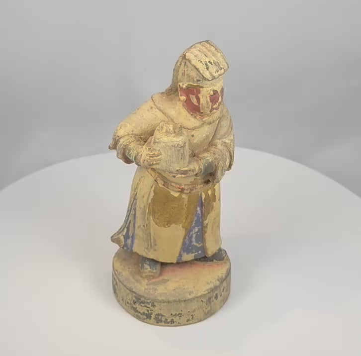 Rotating presentation of an antique Chinese polychrome wooden attendant holding a ceremonial vessel, with a tall headdress and surviving Qing Dynasty pigment.